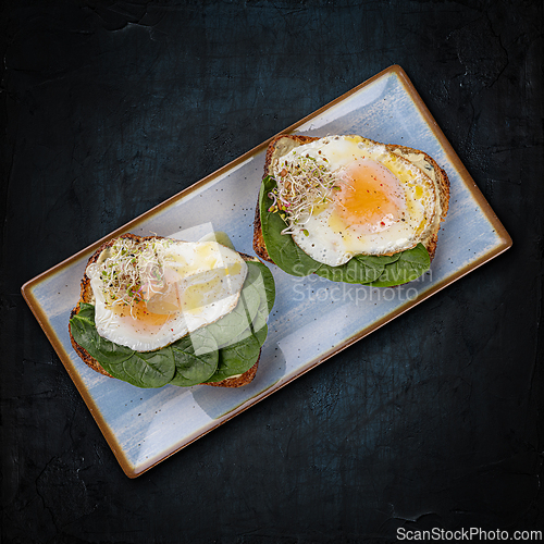 Image of Avocado toast topped with fried eggs