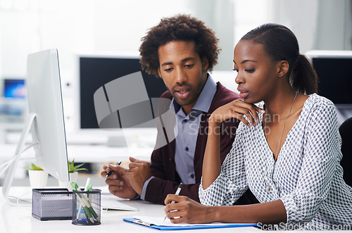 Image of Collaboration, thinking and business black people in office together for planning or strategy. Documents, meeting or teamwork with young woman and woman employee in workplace for agenda or review