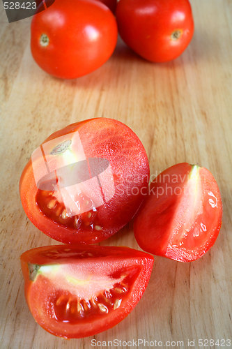 Image of Tomatoes on a chopping board