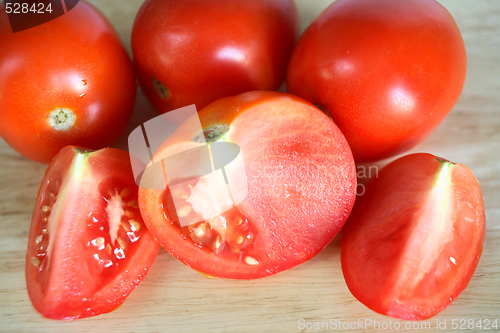 Image of Tomatoes on a chopping board