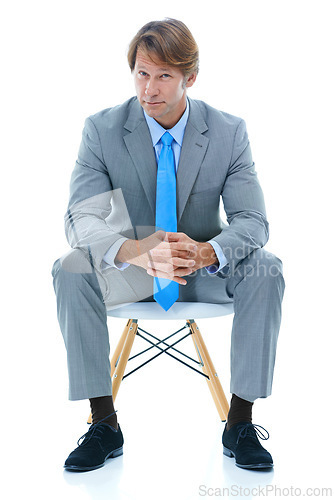 Image of Confident businessman, sitting and studio portrait with ambition in corporate career and professional in suit. Attorney, decision and face in chair for job satisfaction and pride by white background