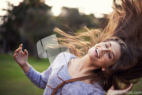 Image of Woman, happy and dancing with hair in wind, female person in nature with carefree creative and moving motion. Summer, enjoy or student on holiday with excited, head and smile for vacation freedom