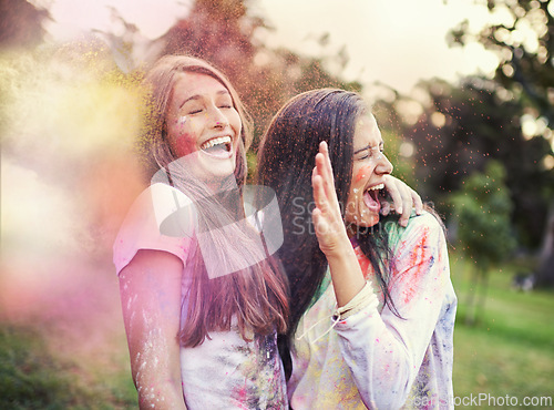 Image of Happy, powder paint and girl friends laugh outdoor with Holi festival and colorful event with smile. Celebration, love and excited in nature with young people and crazy color dust for party together