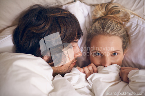 Image of Love, blanket and couple relax in a bed with trust, care and safety, support and security in their home from above. Rest, cuddle and people in a bedroom for afternoon, weekend or day off nap in house