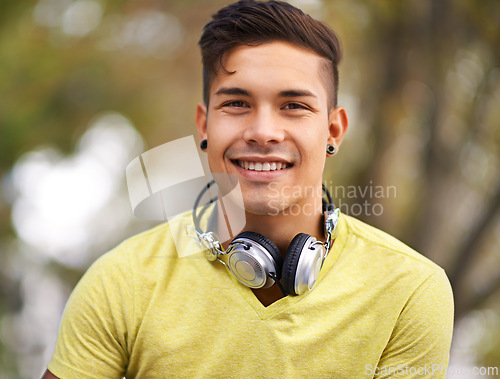 Image of Happy, portrait and young man at skatepark for skating practice or training for competition. Smile, gen z and face of cool male person sitting on ramp with positive, good and confident attitude.