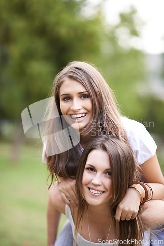 Image of Portrait, happy and couple of friends with piggyback ride for bonding, adventure and summer vacation in outdoor. Smile, relax and woman carrying lady for fresh air, support and quality time together