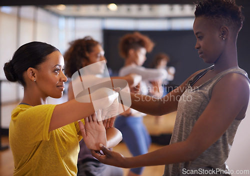 Image of Dance, fitness and people with instructor in class for wellness, balance and theatre performance. Creative dancer, teacher and women in studio for movement pose, exercise and training for practice