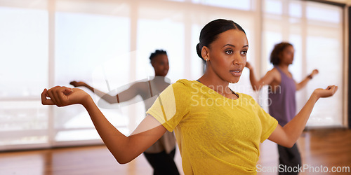 Image of Dancer, woman and training for learning, exercise and fitness in a dance studio with movement routine. People and performance workout of woman with ballet and wellness in a performing arts class