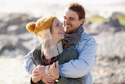 Image of Hug, nature and couple with love, smile and happiness with weekend break and vacation for honeymoon. Outdoor, romance and embrace with woman and man with sunshine and summer with holiday and romance