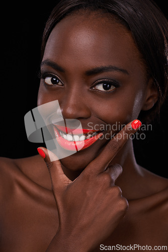 Image of Black woman, lipstick and nail polish for beauty with smile, cosmetics and bright makeup on dark background. Bold, vibrant and orange lip balm with manicure, cosmetology and glamour in studio