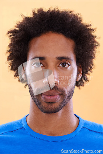 Image of Confidence, serious and portrait of man on yellow background with style, casual clothes and outfit. Facial expression, model and face closeup of isolated person with attitude and pride in studio