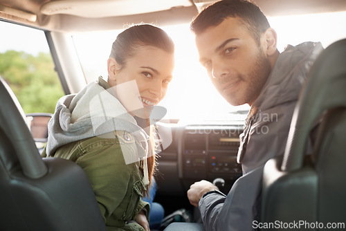 Image of Couple, smile and portrait in car for road trip, travel or journey in vehicle and outdoor for holiday. Man, woman and happy in seat with radio and jacket for driver, passenger and safety together