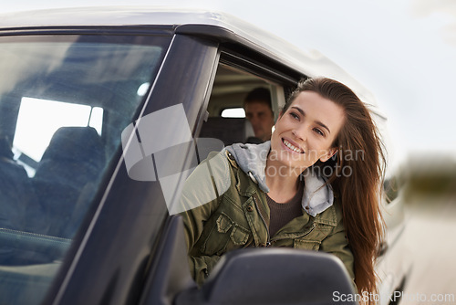Image of Woman, car or window to explore on road trip as thinking, planning or idea of travel and adventure. Smile, female person or traveler on fun driving holiday in motor transport as journey of leisure