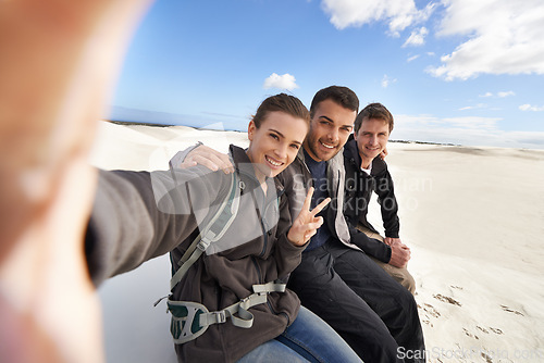 Image of Friends, desert and selfie with smile for adventure in happiness for holiday, road trip and travel together. People, memory and excited in sand dunes for vacation or break with bonding for fun