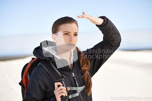 Image of Hiking, sand dunes and woman in nature walking for adventure, desert landscape and travel for holiday. Hiker, explorer and nomad person in Sahara terrain, outdoor and dry climate for view or scenery