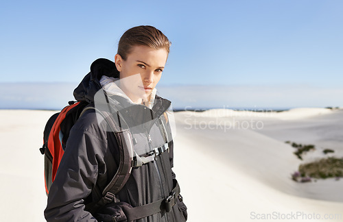 Image of Portrait, sand dunes or woman in nature to hike for adventure, desert landscape and travel for holiday. Mockup, hiker or nomad explorer in Sahara terrain, outdoor and dry climate for view or scenery