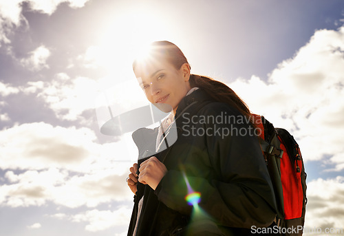 Image of Ready, sky and portrait of woman hiking in adventure or outdoor travel for holiday vacation. Clouds, sunshine or nomad explorer trekking in journey, nature or trip exercise for wellness or walking