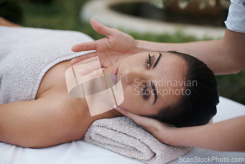 Image of Spa, woman and face with massage for wellness at resort, luxury hotel and vacation for relax and therapeutic pamper. People, masseuse and body care with facial treatment, hospitality and zen outdoor