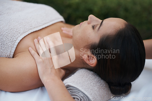 Image of Spa, woman and hands with massage for wellness at resort, luxury hotel and vacation for relax and therapeutic pamper. People, masseuse or body care with shoulder treatment, hospitality or zen outdoor