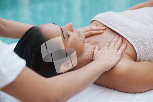 Image of Hands, woman and masseuse at spa for massage, health and wellness for zen, therapy or peace. Female person, lady or relax for luxury, body or wellbeing on table, natural or calm near pool