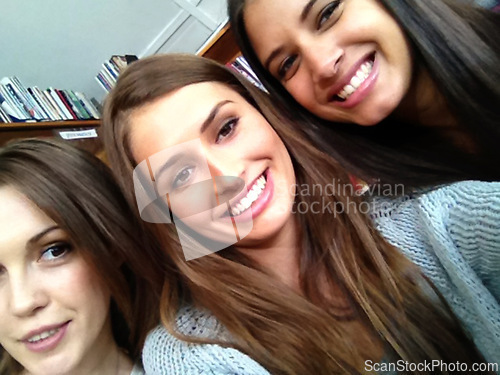 Image of Women, university student and selfie as friends with smile in library on campus for study break or group work for exam. Classmates, college and leisure with happiness for photo for assignment bonding