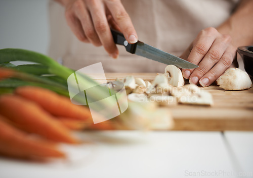 Image of Cooking, food and hands with vegetables in kitchen on wooden board for cutting, meal prep and nutrition. Healthy diet, ingredients and person with mushrooms for vegetarian dinner, lunch and salad