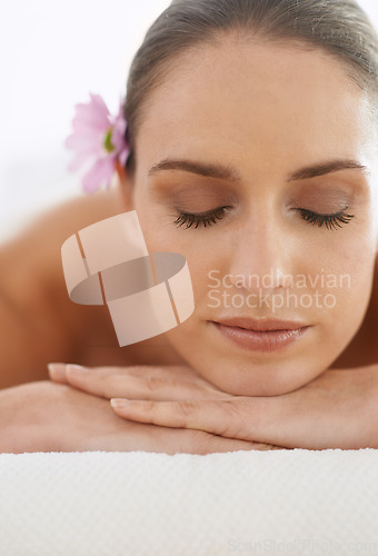 Image of Relax, massage and face of woman at spa for health, wellness and balance with luxury holistic treatment. Self care, zen and girl on table for body therapy, comfort and calm pamper service at hotel