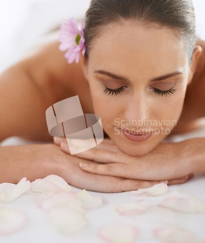 Image of Zen, massage and face of woman at spa for health, wellness and balance with luxury holistic treatment. Self care, relax and girl on table for body therapy, comfort and calm pamper service at hotel