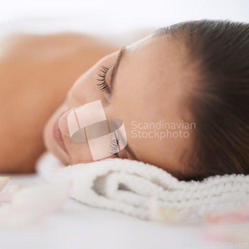 Image of Sleep, massage and face of woman at spa for health, wellness and balance with luxury holistic treatment. Self care, peace and girl for body therapy, comfort and calm pamper service to relax at hotel