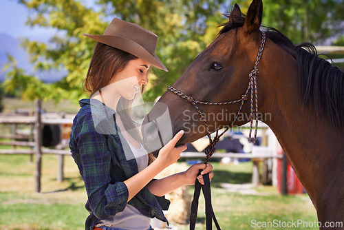 Image of Cowgirl, happy and woman with horse at farm outdoor in summer or nature in Texas for recreation. Western, smile and female person with animal at ranch, pet or stallion in the countryside together