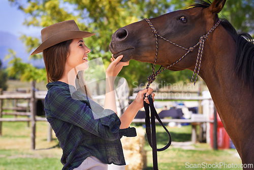 Image of Cowgirl, smile and woman with horse at farm outdoor in summer or nature in Texas for recreation. Western, happy female person and animal at ranch, pet or stallion in the rural countryside for care