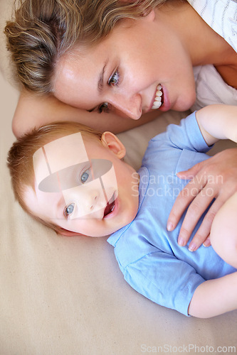 Image of Baby, bonding and happy with mother, relaxing and love together with child and care for motherhood. Infant, mom and smile for affection, nurture and home for growth and babysitting with family