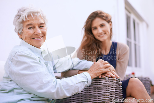 Image of Portrait, senior and mother in nursing home together with daughter, outdoor and woman to visit wise mom. Girls, smile and holding hands as family, happy and retirement of elderly female person