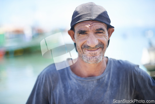 Image of Fisherman, portrait and rugged man with smile, harbour and wrinkles from sunlight exposure. Boats, ships and water or fishing for work in Brazil, closeup and senior male angler for career by ocean