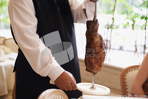 Image of Waiter, fine dining and meat with service, skewer and restaurant for dinner or lunch. Person, food and luxury with gourmet, meal and expensive cuisine with beef or protein on stake at elegant diner