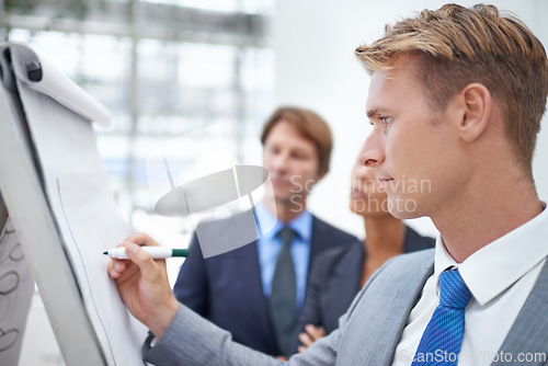 Image of Businessman, flipchart and writing in office with meeting for project planning, stocks performance and profit management. Financial analyst, employee and person with presentation of data in workplace