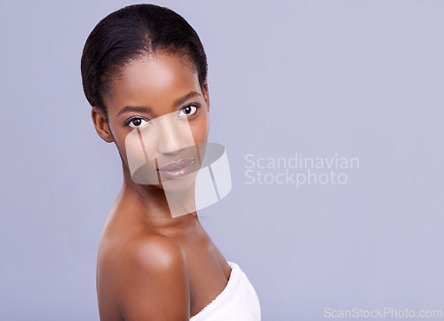 Image of Beauty, skincare and portrait of serious black woman with glowing skin, natural spa makeup and studio space. Mockup, dermatology and luxury cosmetics with healthy face of girl on grey background.