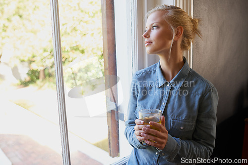 Image of Thinking, calm and woman with tea in a house for peaceful, reflection or moment at home. Remember, nostalgic and female person with drink, memory or enjoying me time, day off or weekend in apartment