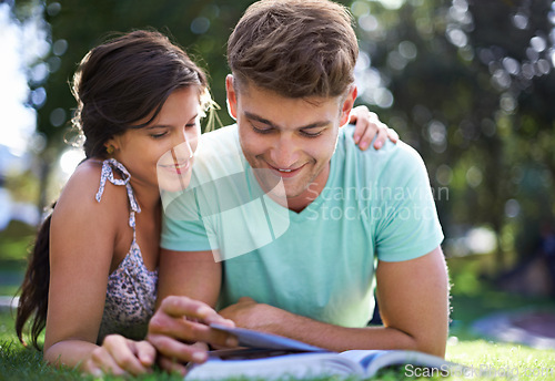 Image of Happy, grass and couple with books for reading, learning and studying together outdoors at college. University, education and man and woman with textbook in park for bonding, relax and rest on campus