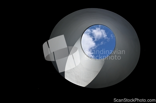 Image of blue sky and cloud in a round light well