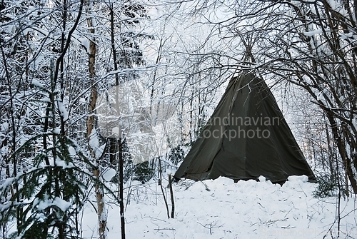 Image of indian tepee in the winter forest