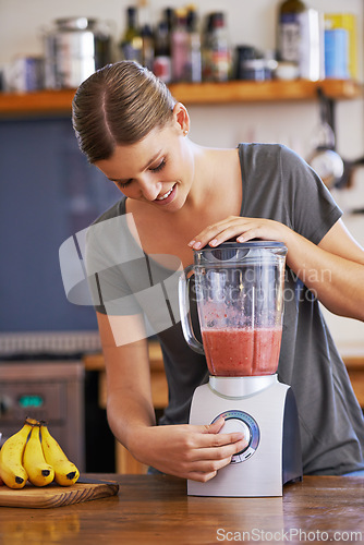 Image of Kitchen, smile and woman on blender for smoothie, nutrition or food for healthy diet at table in home, Happy person, fruit and mixer for drink, juice or ingredients for wellness with organic beverage