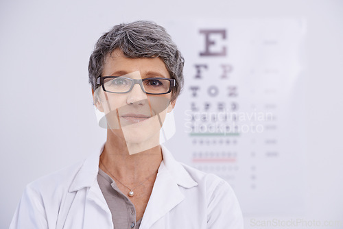 Image of Portrait, senior woman and optometrist for eye care, letter chart for exam with doctor at clinic. Alphabet, glasses for vision and prescription lens, assessment and ophthalmology for spectacles