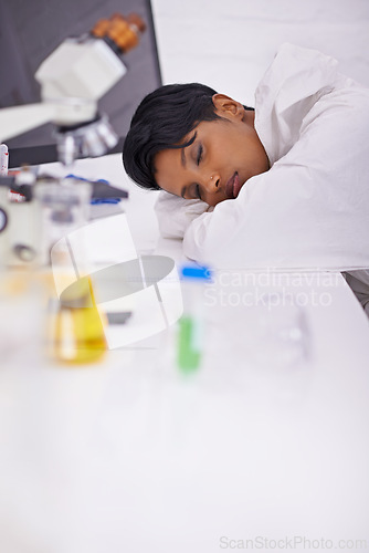 Image of Nap, tired and woman scientist in laboratory working overtime on pharmaceutical research. Exhausted, fatigue and female biology researcher with sleeping for burnout with medical project or study.