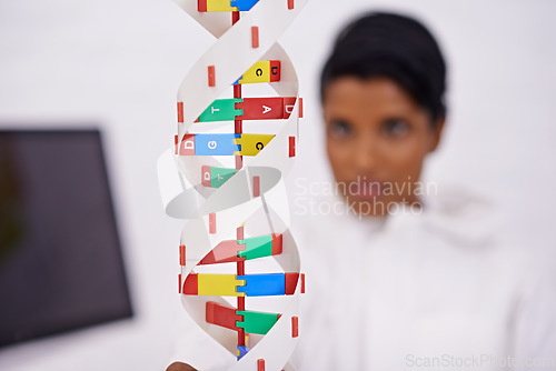Image of DNA model, person or lab as science, research or medical innovation by technology, women or study. Female scientist, chemistry or molecular clone in analysis, experiment or breakthrough in healthcare