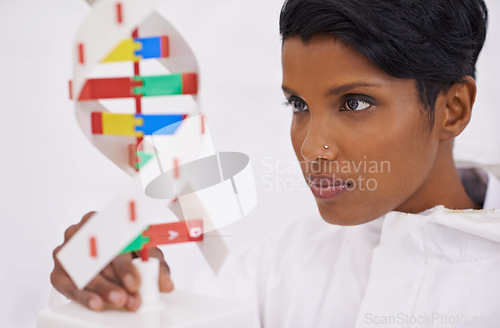 Image of DNA model, scientist or lab research in medical, bio chemical or scientific innovation as forensic. Woman, chemistry or molecular clone in analysis, experiment or breakthrough in genetic test