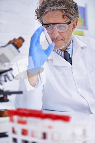 Image of Scientist, blood and test tube in laboratory, healthcare facility and chemistry for medical research. Male person, science expert and doctor with results for analysis, dna and forensic study