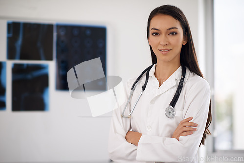 Image of Portrait, confident doctor and woman in hospital for healthcare, wellness or xray in Brazil. Face, medical professional and employee with arms crossed, worker or radiology expert with pride in clinic