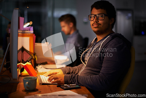 Image of Portrait, male programmer and late night with computer, deadline and online worker. Dark, person or digital internet specialist in evening for work, office and tech expert or coding in workplace