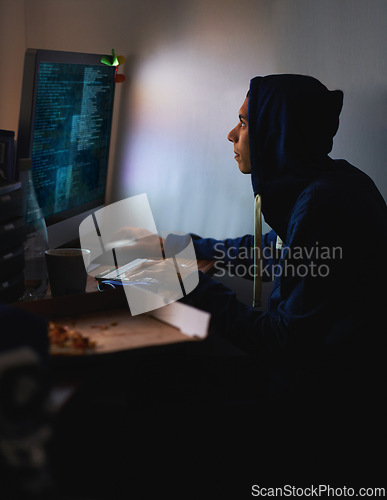 Image of Night, hacker or man with computer, tech or typing with server or programmer with nerd or geek. Person, home or guy with pc or online reading with dark room or cyber security with network or internet